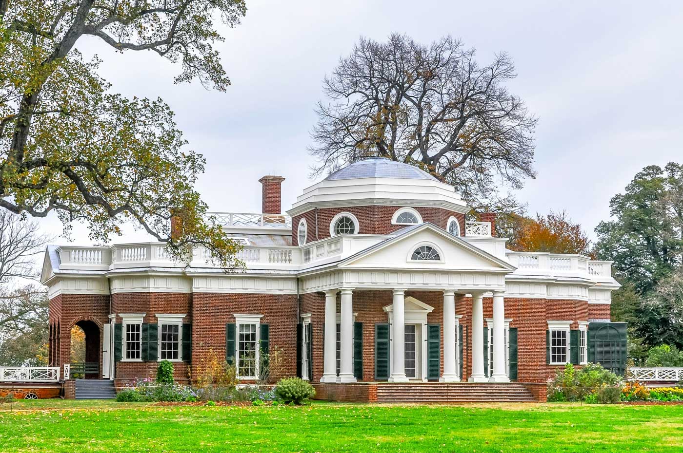 A mansion with yard surrounded by a few trees in Virginia.