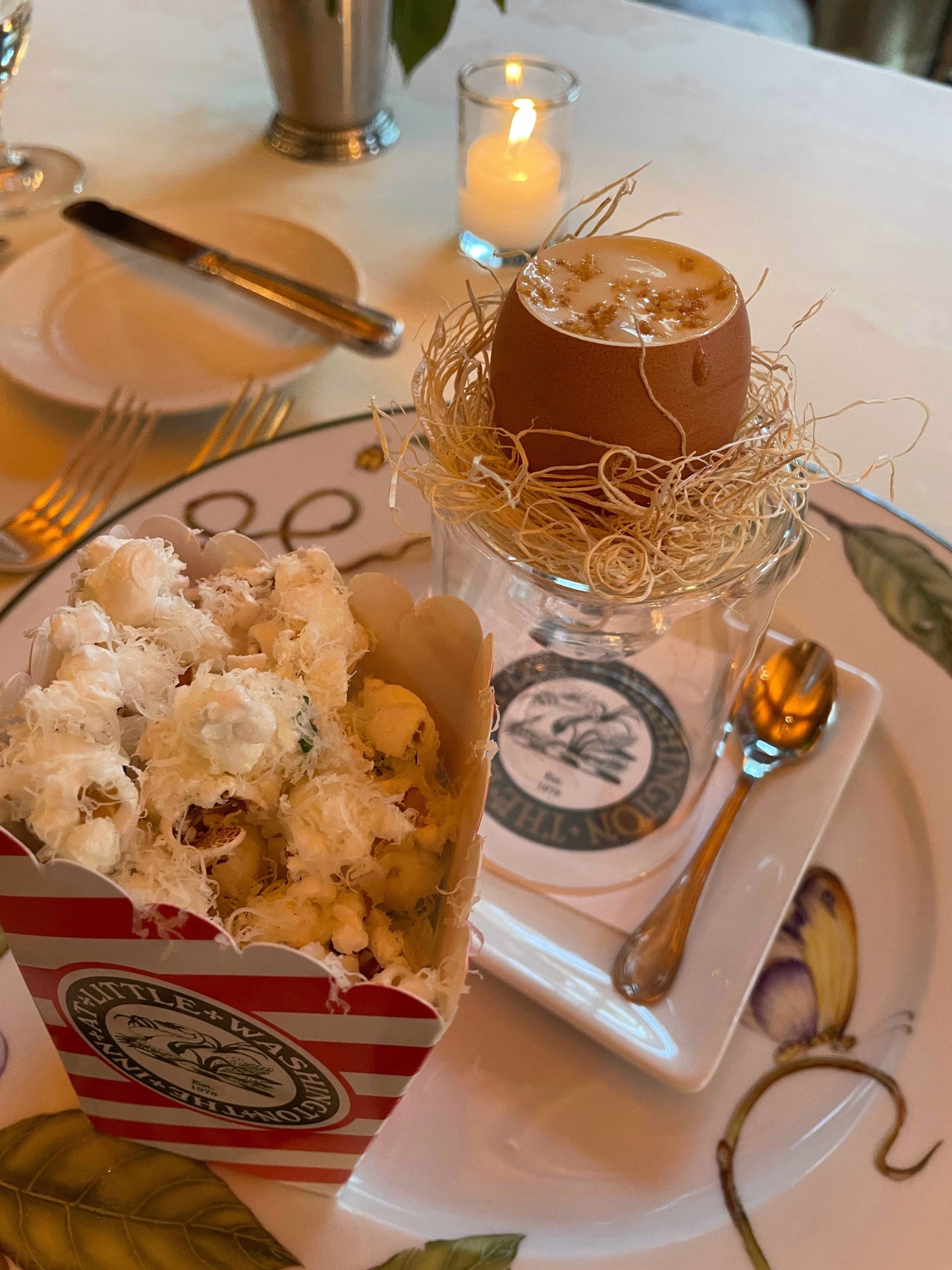 Cheese souffle in an egg and popcorn amuse bouche at The Inn at Little Washington.
