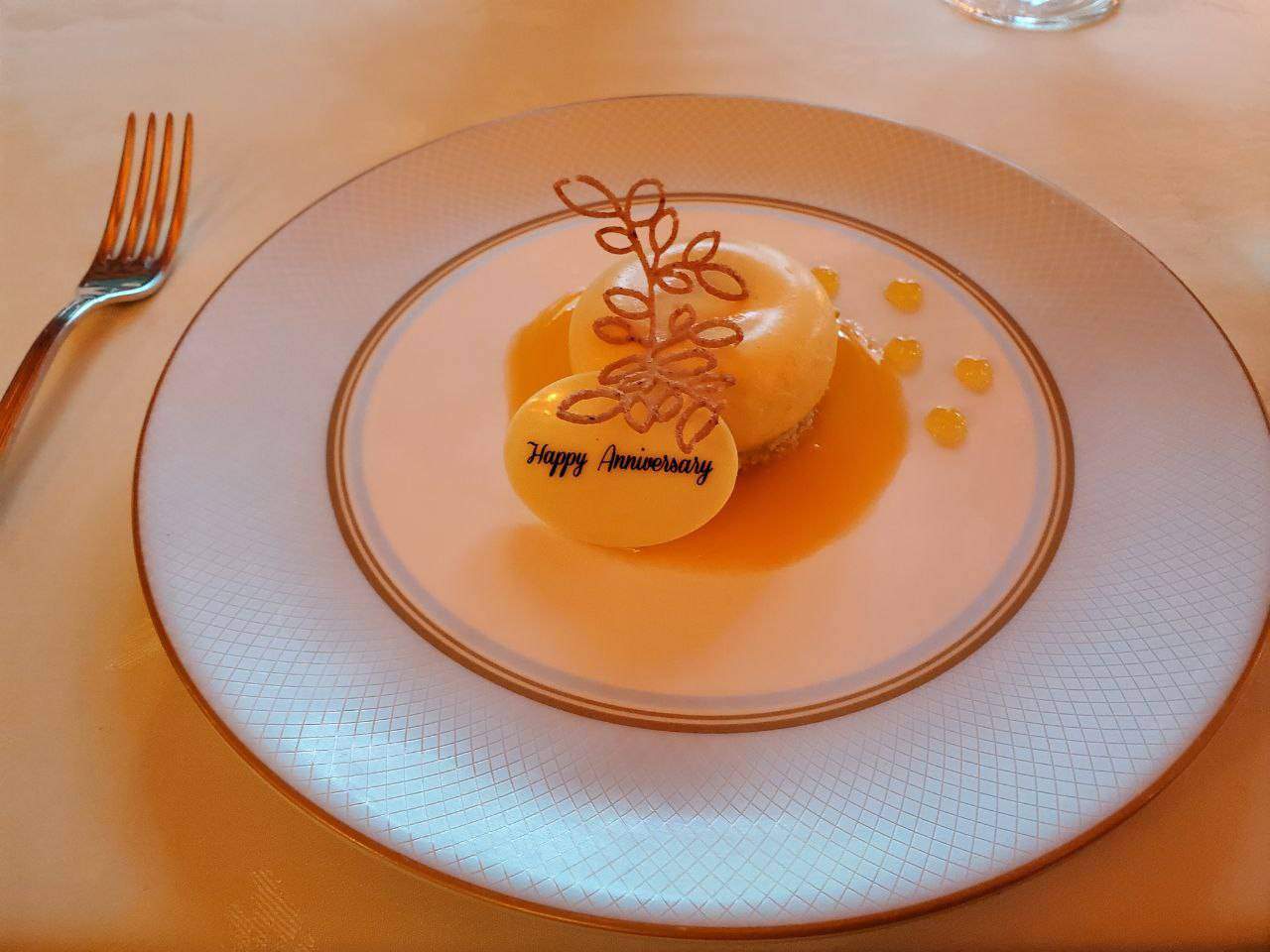 Dessert on a plate with "Happy Anniversary" message.