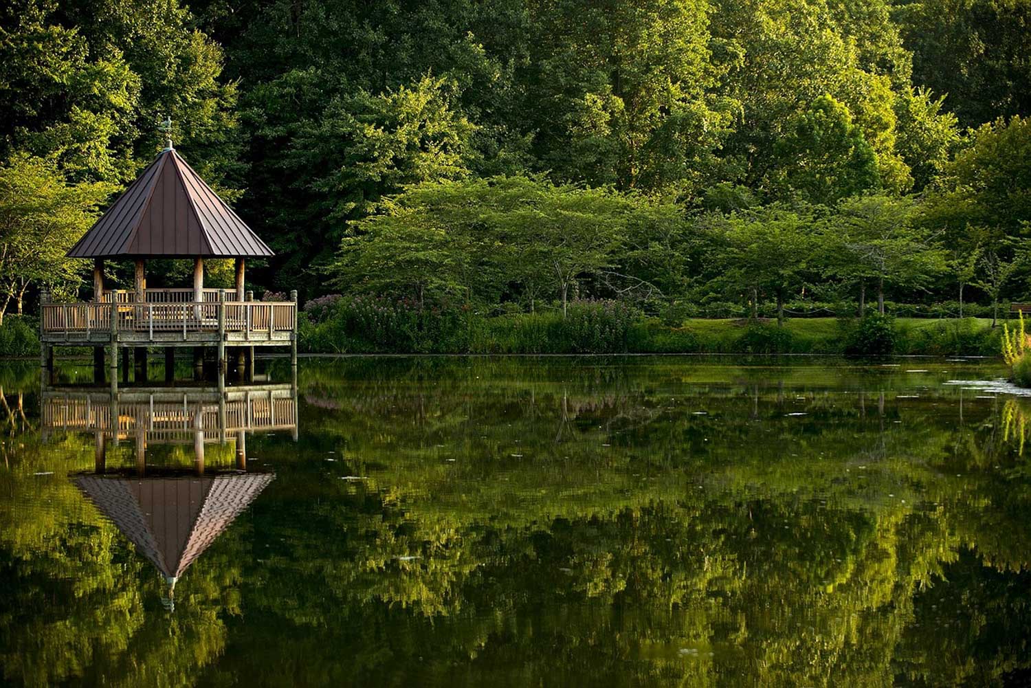 A gazebo on a lake surrounded by trees in Virginia.