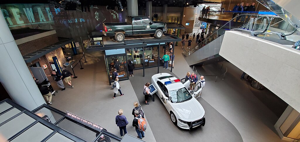 Police vehicles and other law enforcement materials displayed inside a museum in Washington DC.