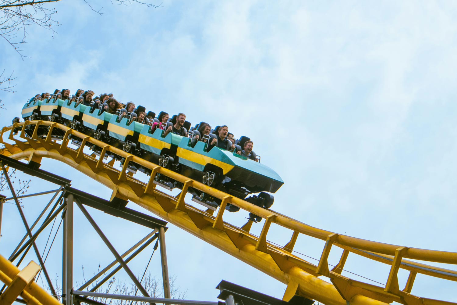 People riding a rollercoaster.