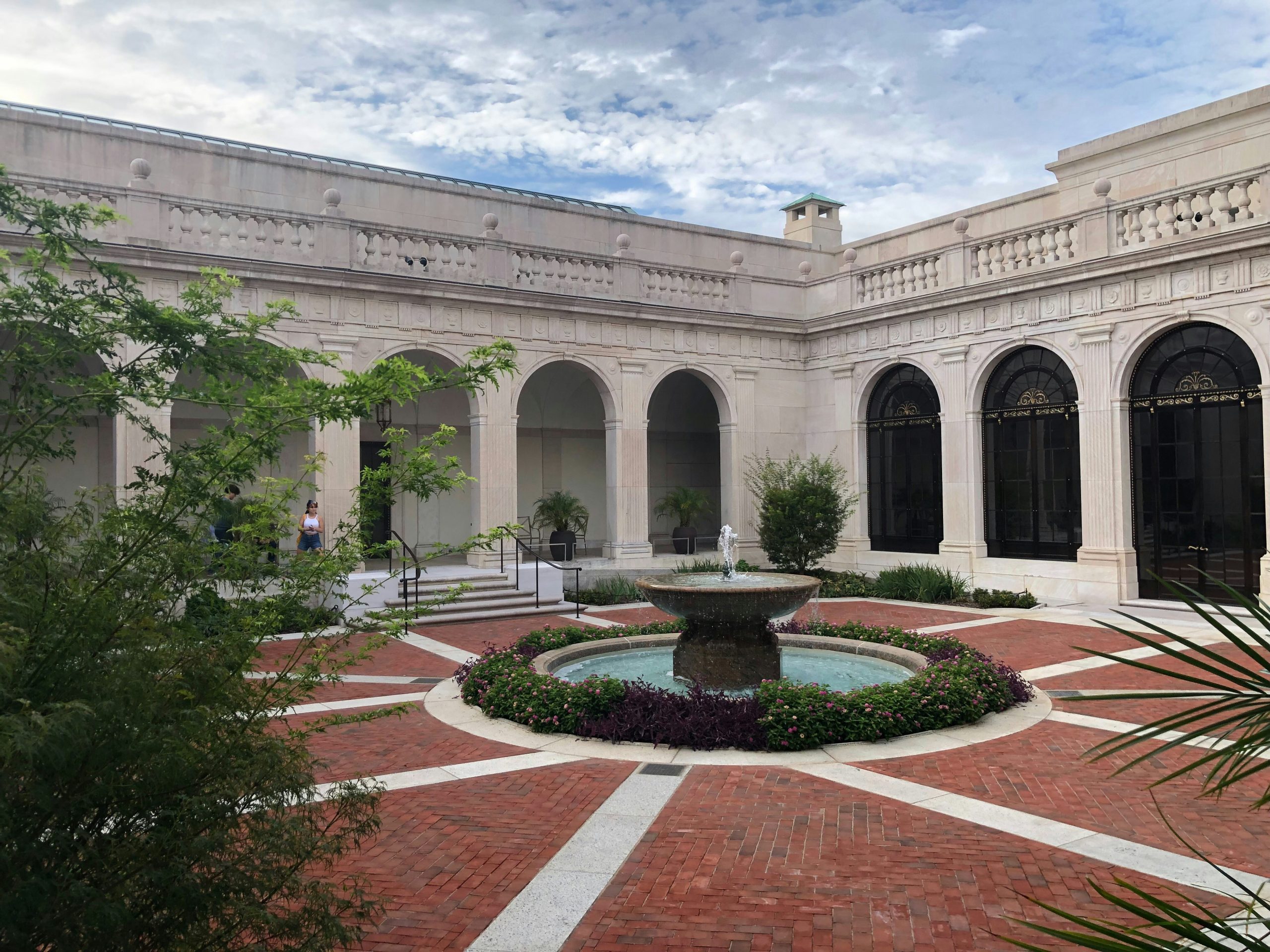A courtyard of a building in Washington DC with fountain.