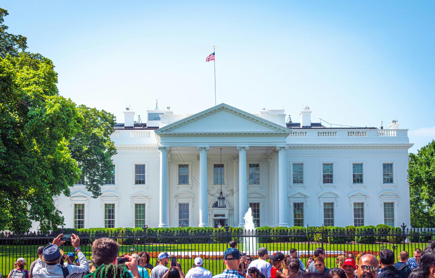 People taking pictures of the White House in Washington DC.
