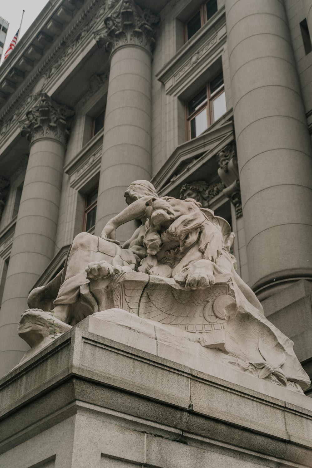 A statue outside a museum building in Washington DC.