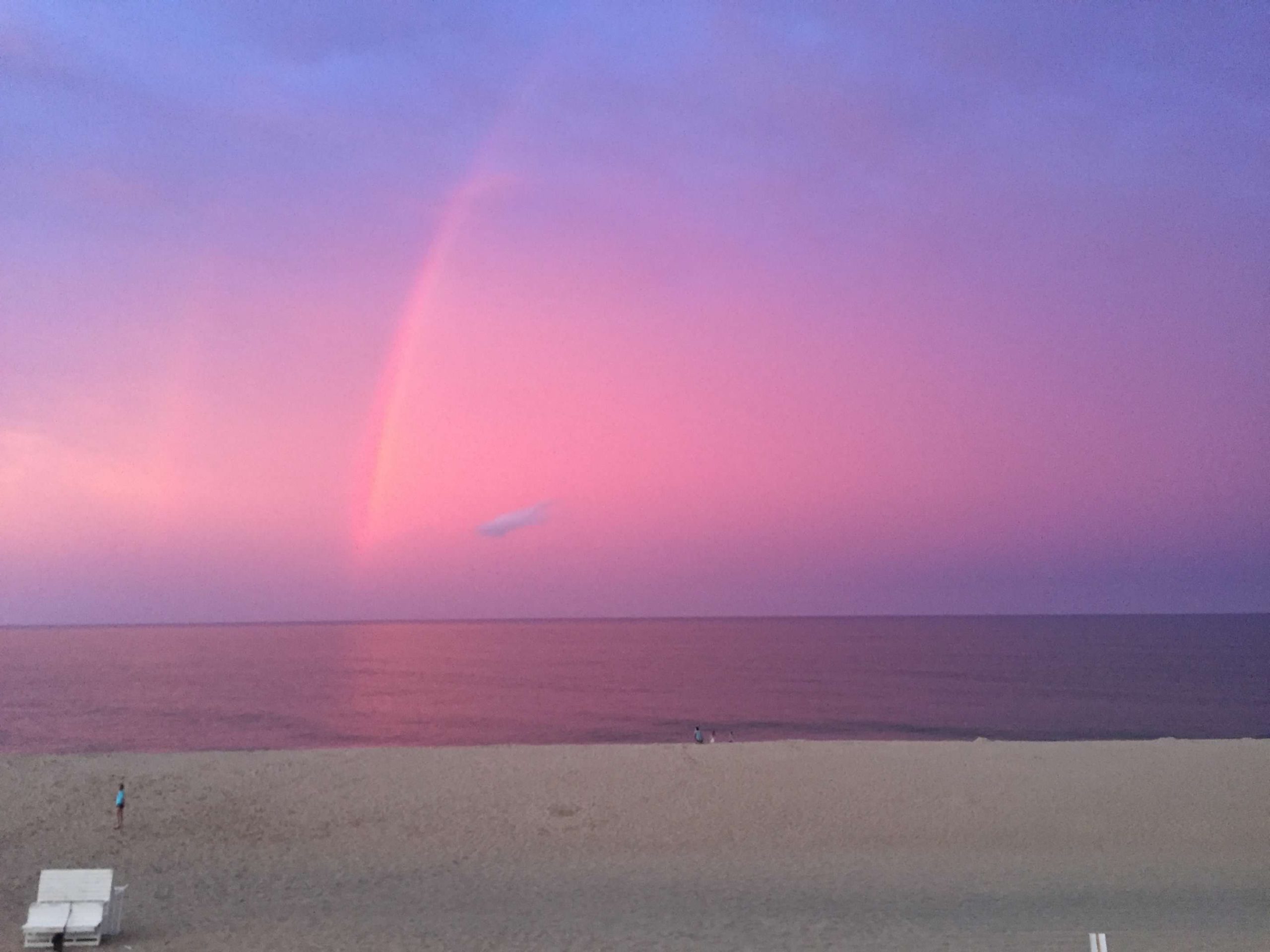 Purple-pinkish sky sunset at a beach.