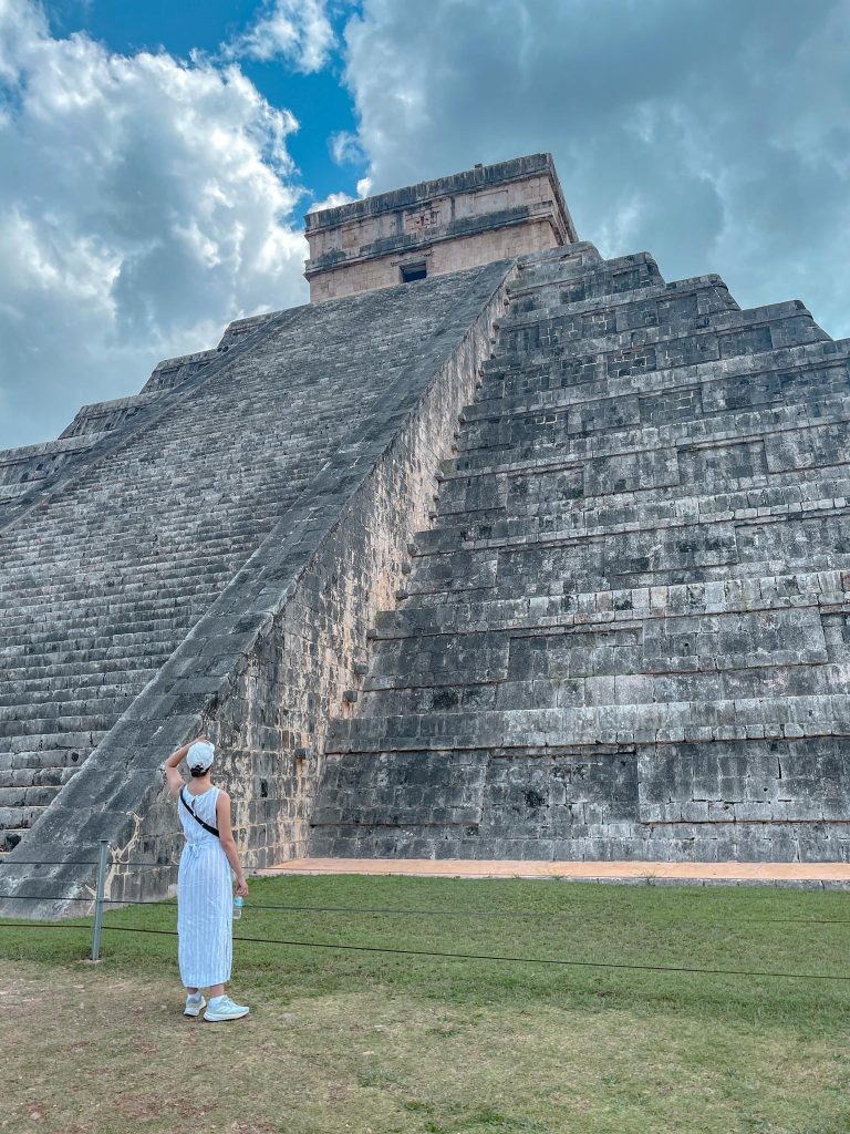 girl looking up at chichen itza