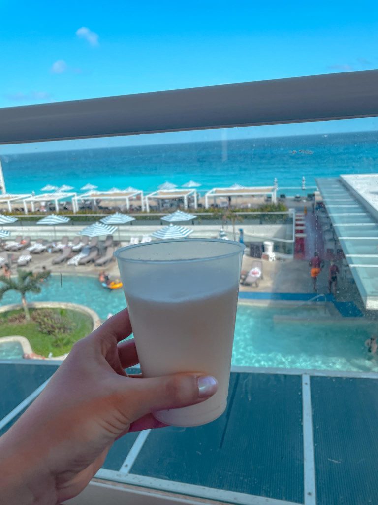pina colada drink with ocean view in cancun