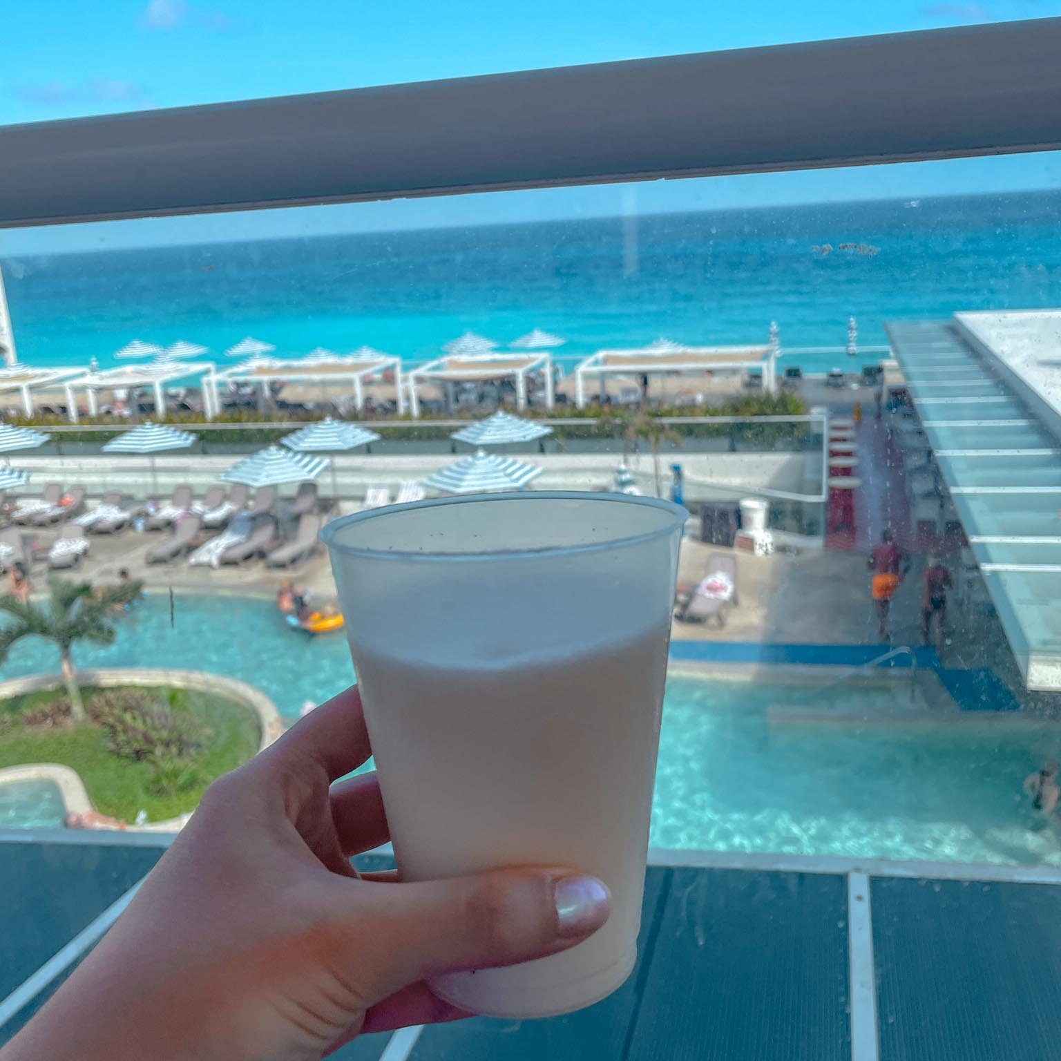 pina colada drink with ocean view in cancun