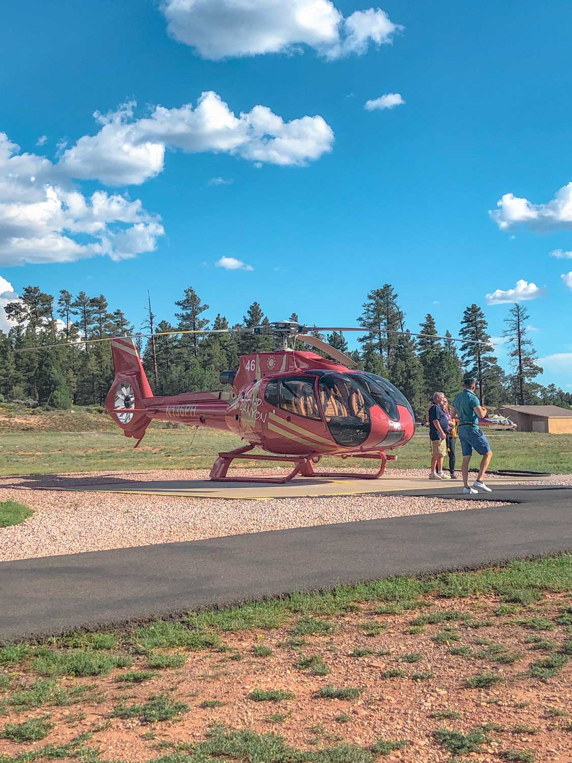 Red helicopter in a desert.