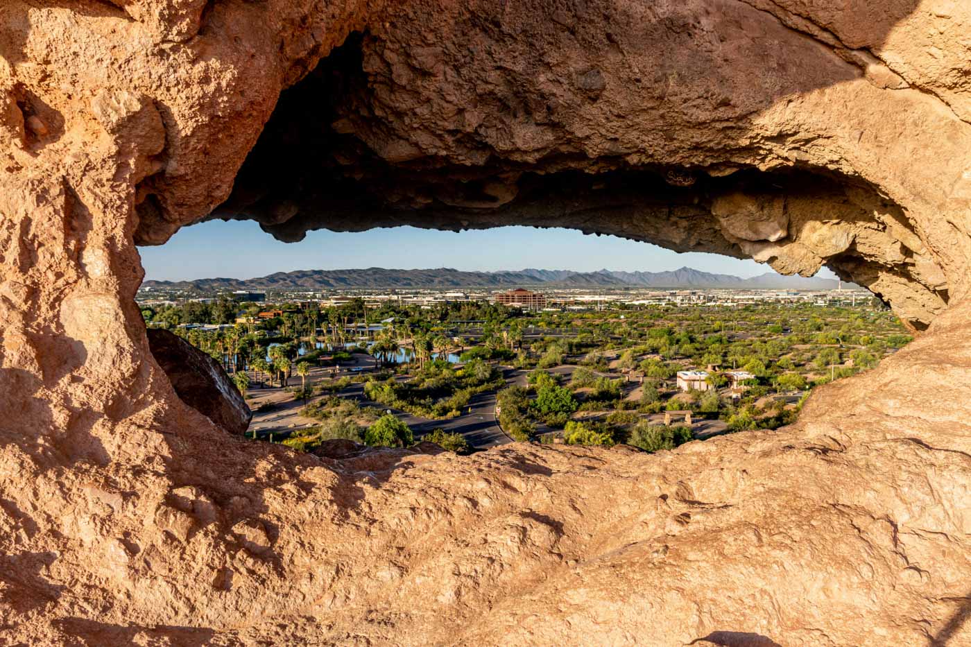 A view of Phoenix Arizona between rocks.