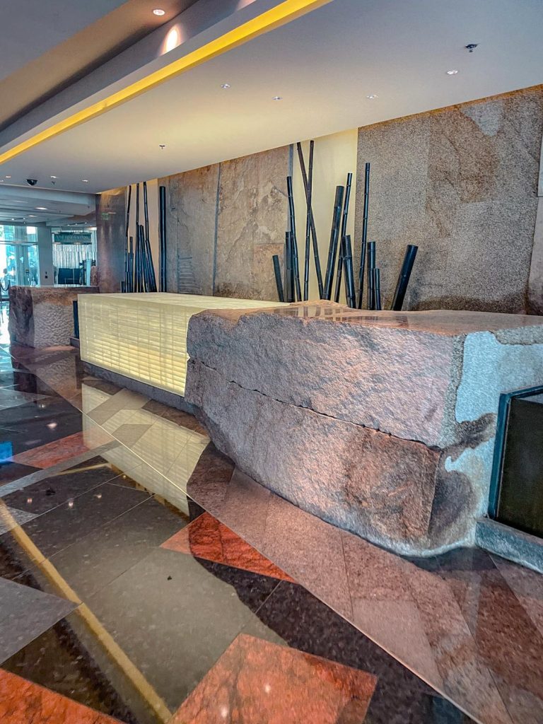 The reception area of a Las Vegas hotel spa with big stone counter.
