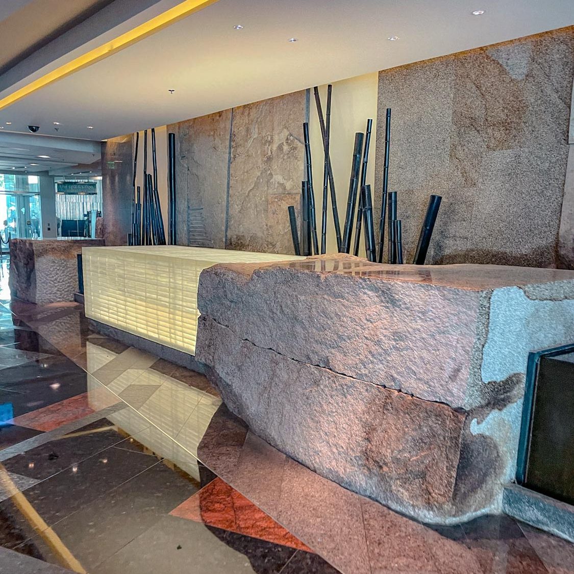 The reception desk of a Las Vegas Strip hotel spa with big stone counter.