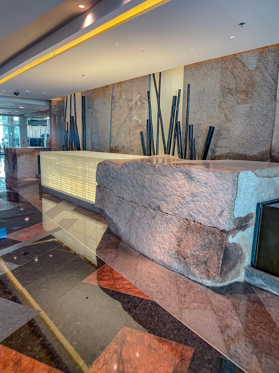 The lobby inside ARIA Resort and Casino with big rock counters.