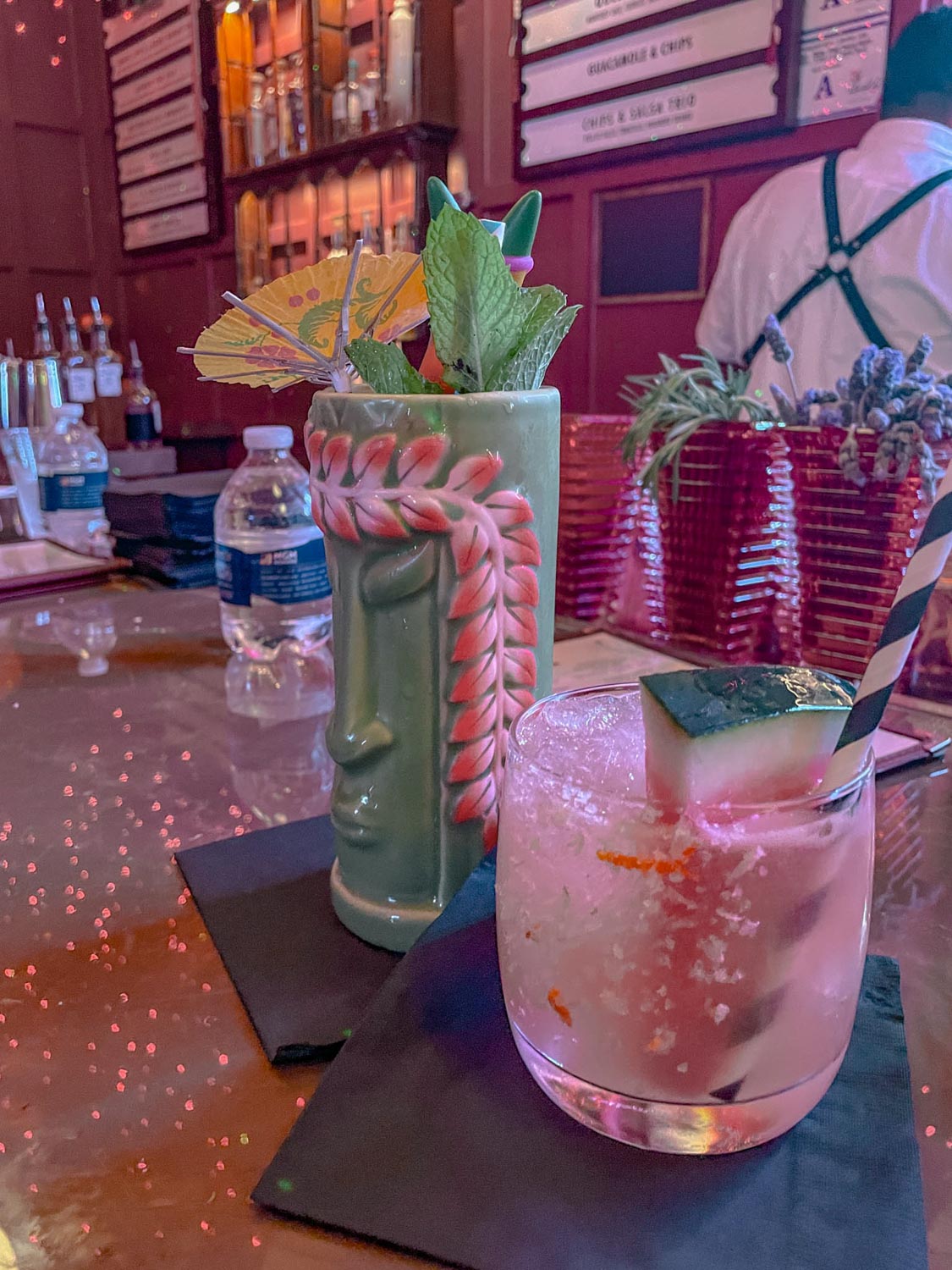 Drinks in glasses and mugs with fruits and herbs at a bar in Las Vegas.