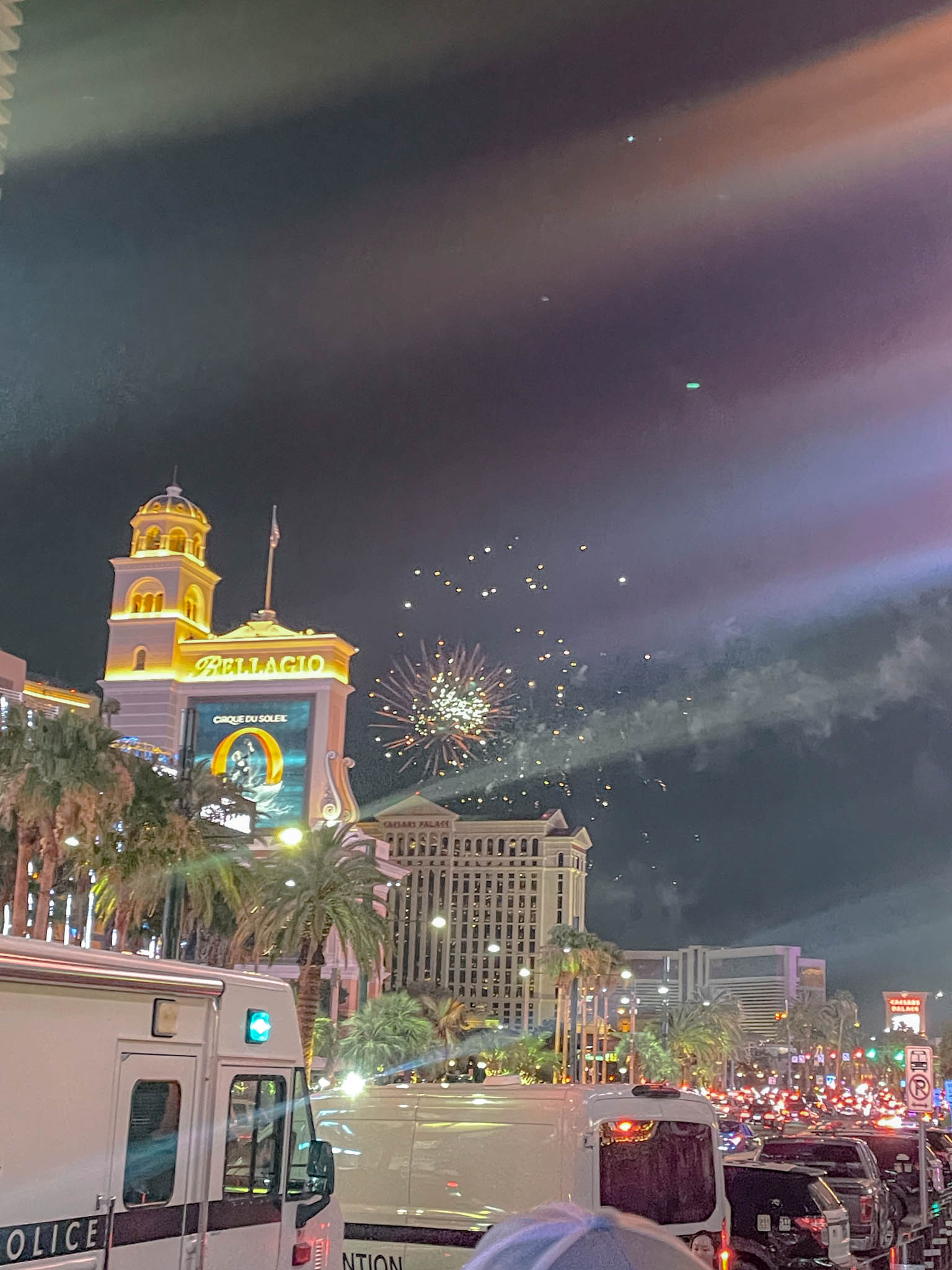 Fourth of July fireworks near a hotel in Las Vegas with a view of the road.