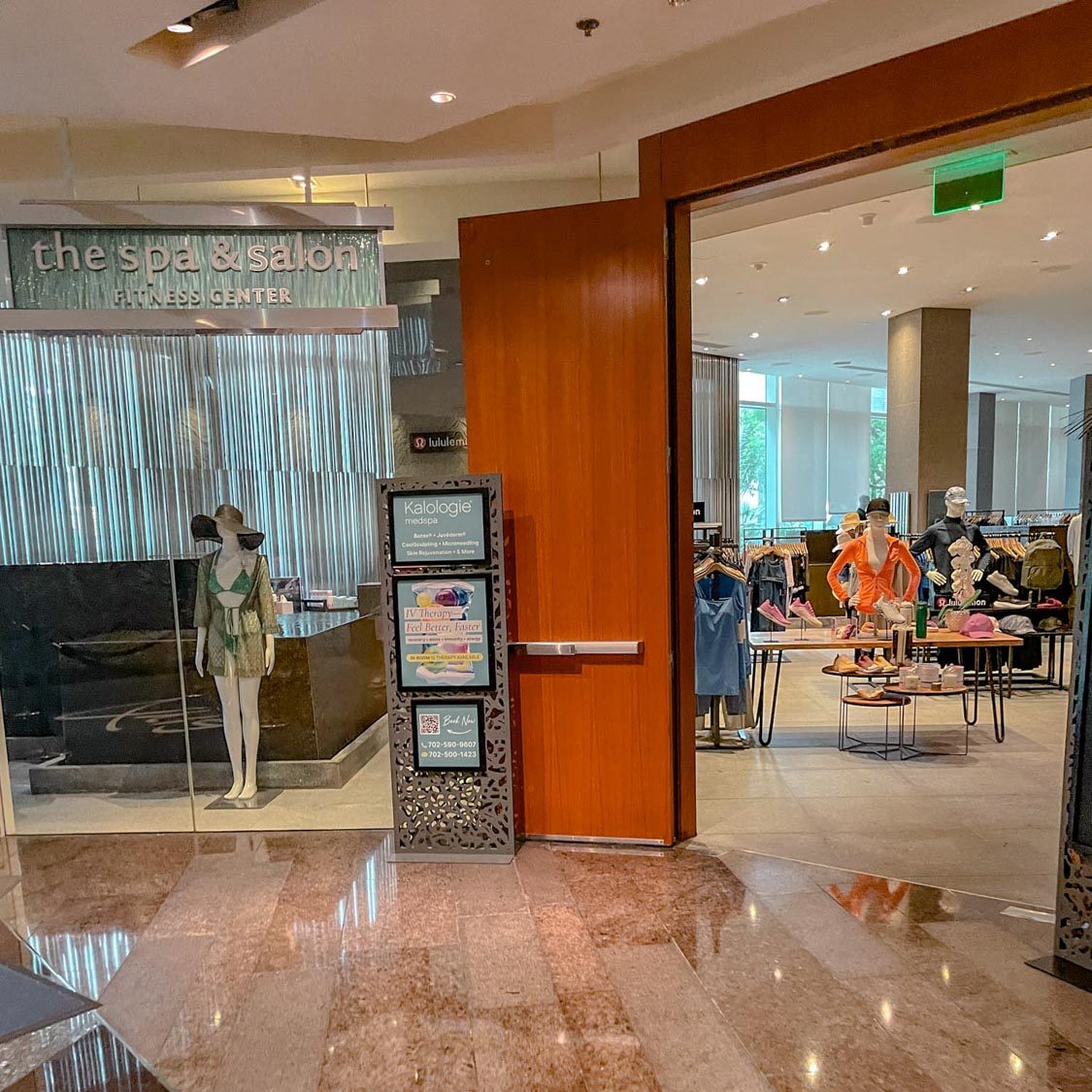 The entrance of a Las Vegas Strip hotel spa with big wooden doors.