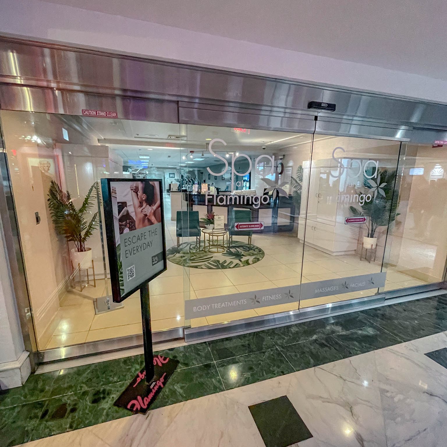 The entrance of a Las Vegas hotel spa with sliding doors.
