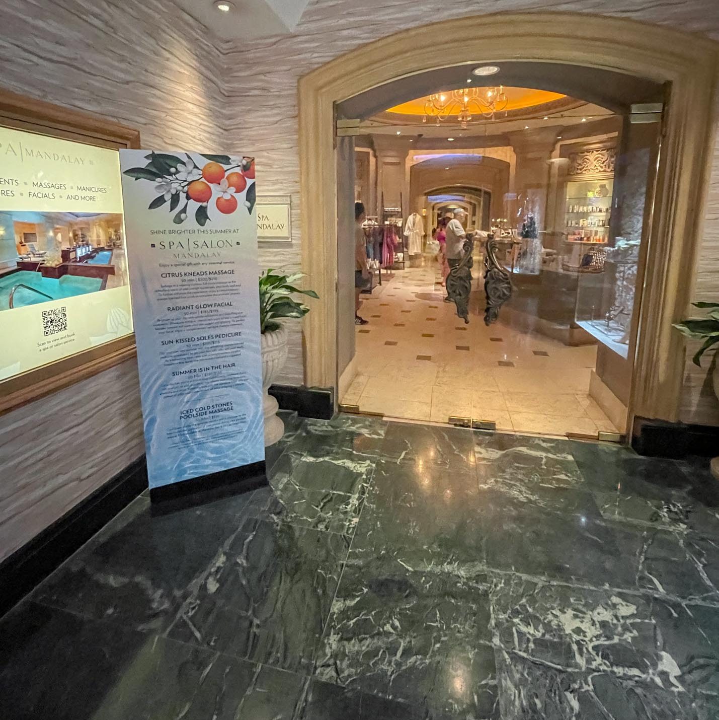 The entrance of a Las Vegas hotel spa with marble floor.