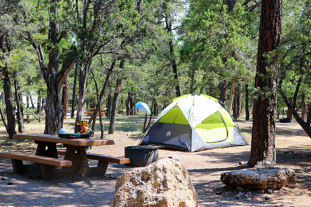 Campground with tent, table, bench and grill at Grand Canyon South Rim.
