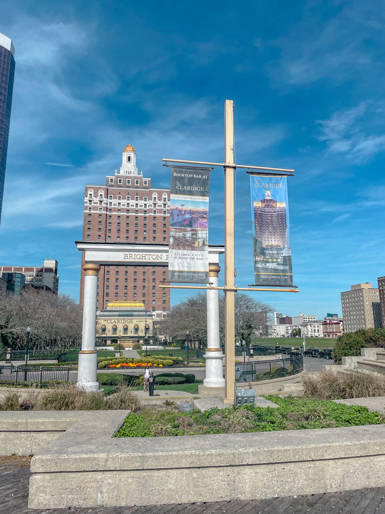 A park surrounded by buildings in Atlantic City on a sunny day.