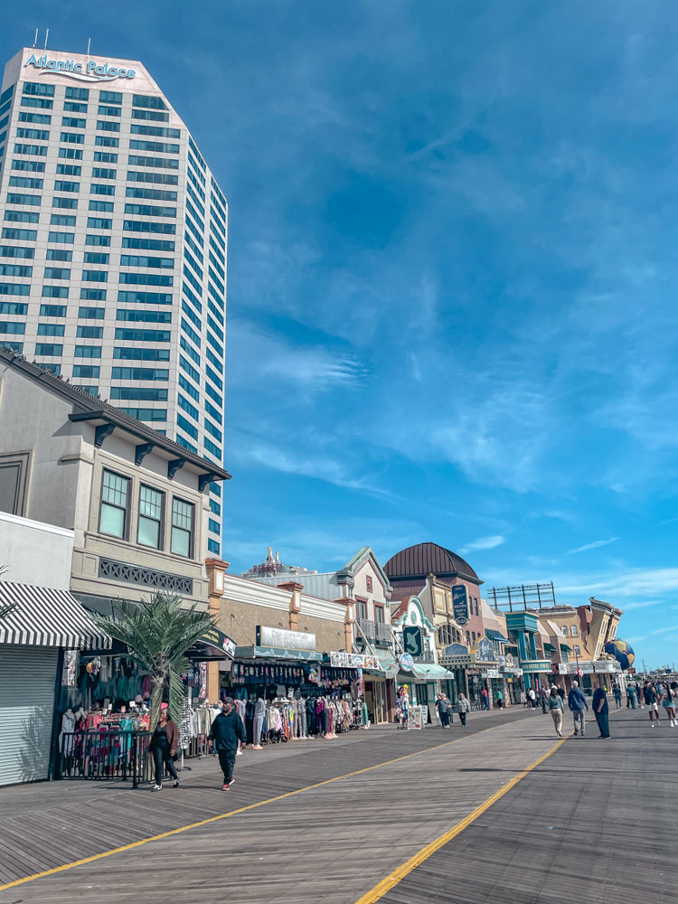 People walking on the Atlantic City boardwalk.