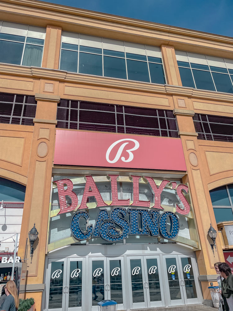 The outside of a casino with a sign that says "Bally's Casino".