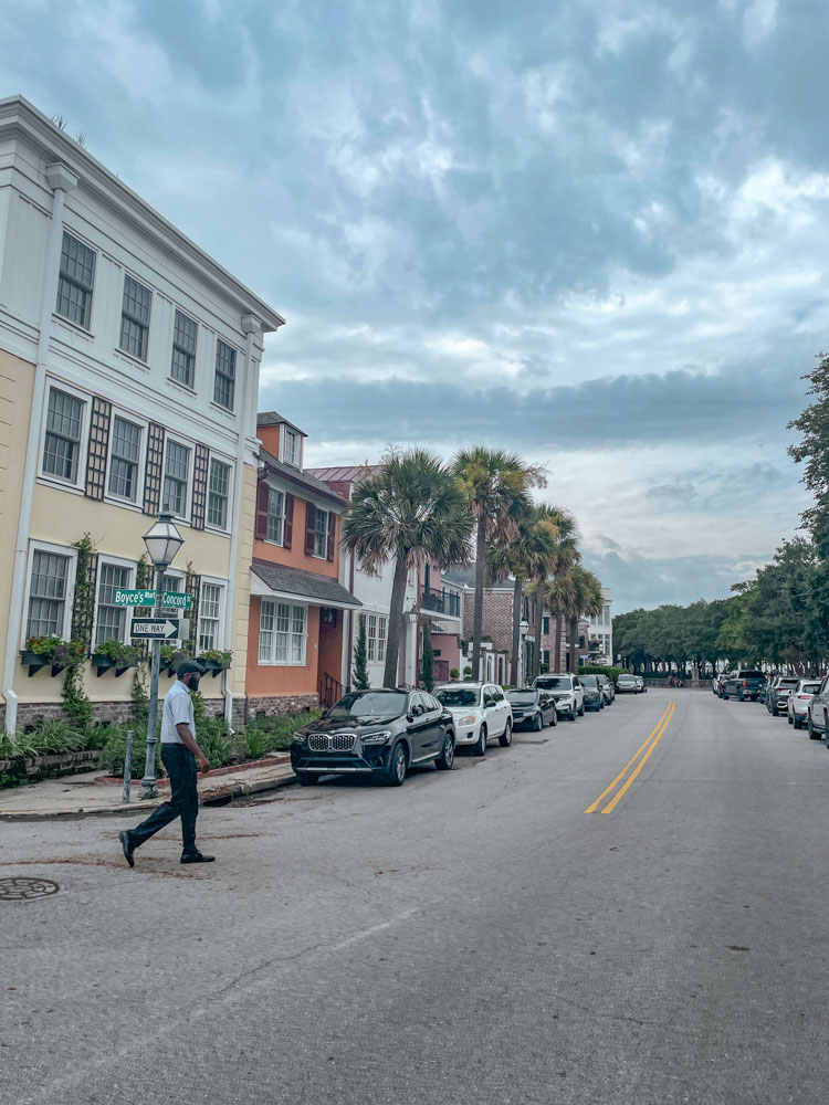A man crossing a street in downtown Charleston, South Carolina.