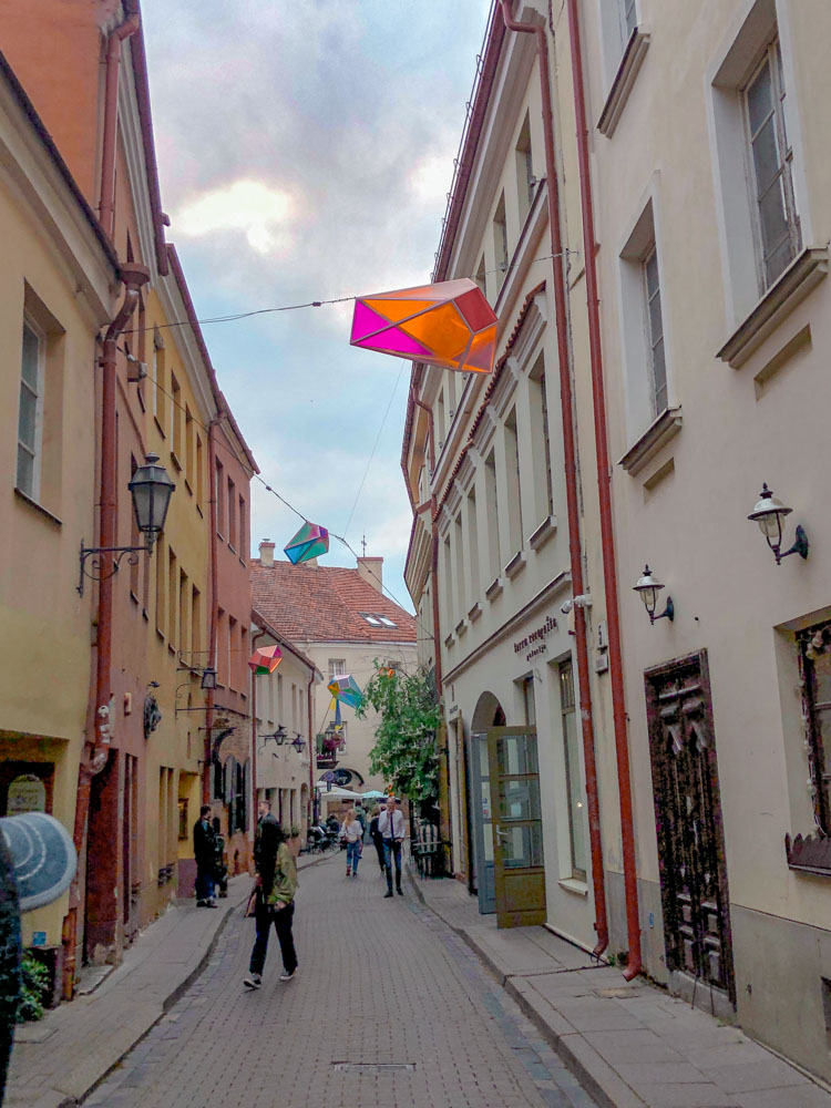 People walking on a street in Old Town Vilnius, Lithuania.