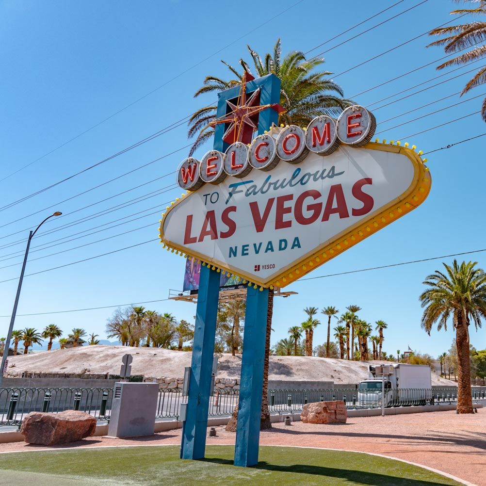 A sign that says "Welcome to Fabulous Las Vegas Nevada" sign with palm trees.