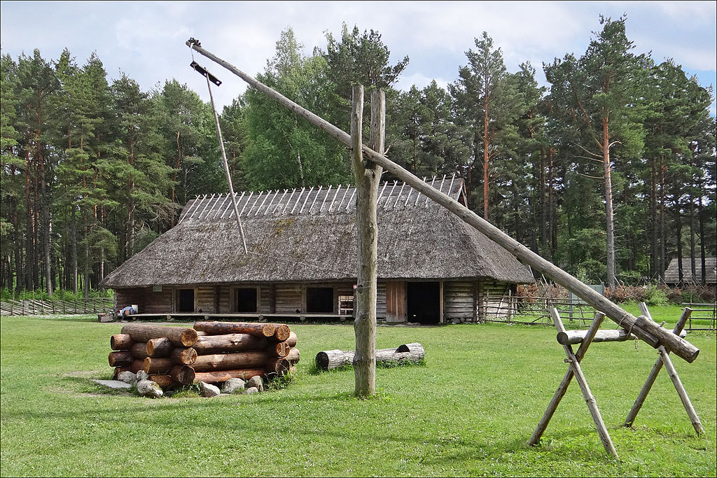 Old, traditional residential building at the Open-Air Museum surrounded by trees in Tallinn, Estonia.