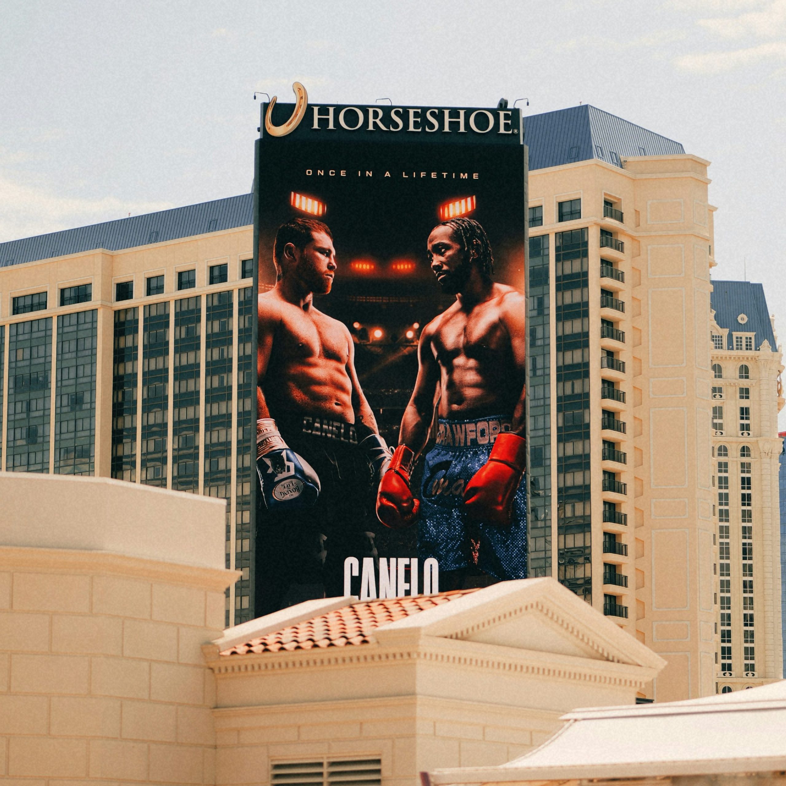 A giant poster of two boxing players displayed near a Las Vegas hotel.