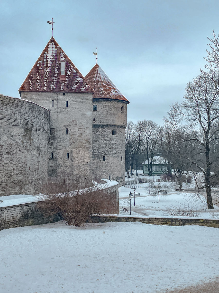 Snowy area surrounding a castle-like museum in Tallinn, Estonia.