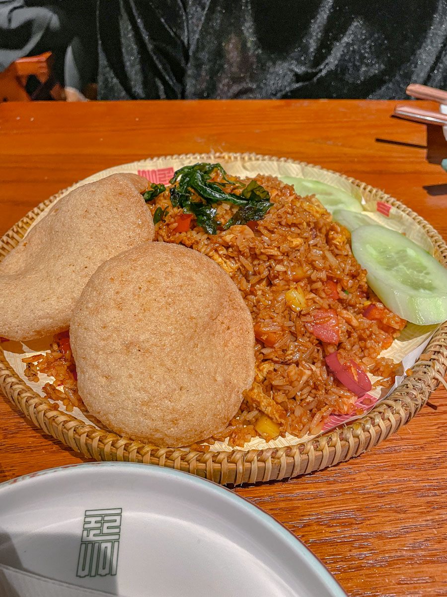 Rice meal on a wooden plate.