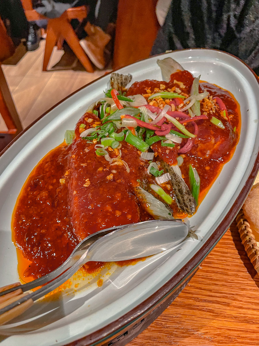 With with red sauce in a white oval plate.