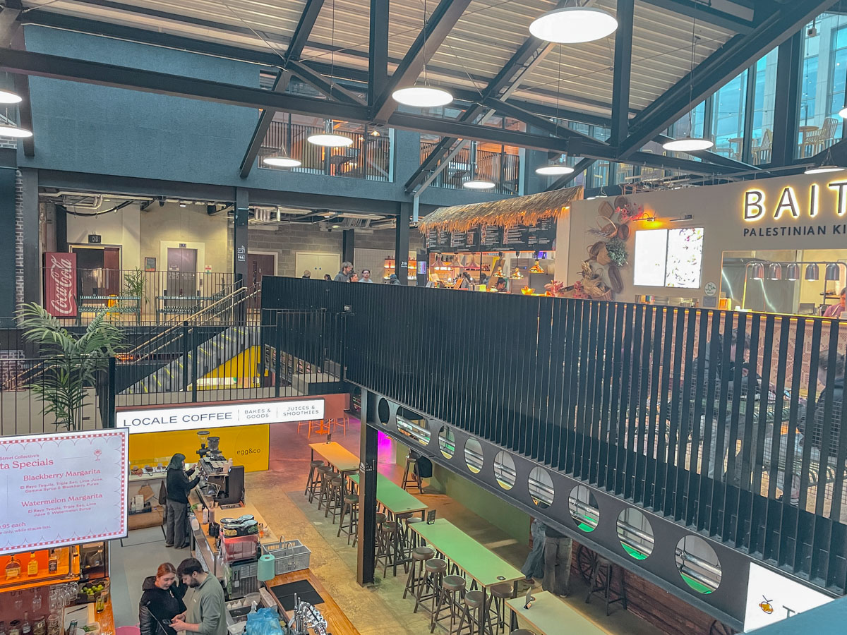 The inside of a two-storey food hall in Sheffield, UK.