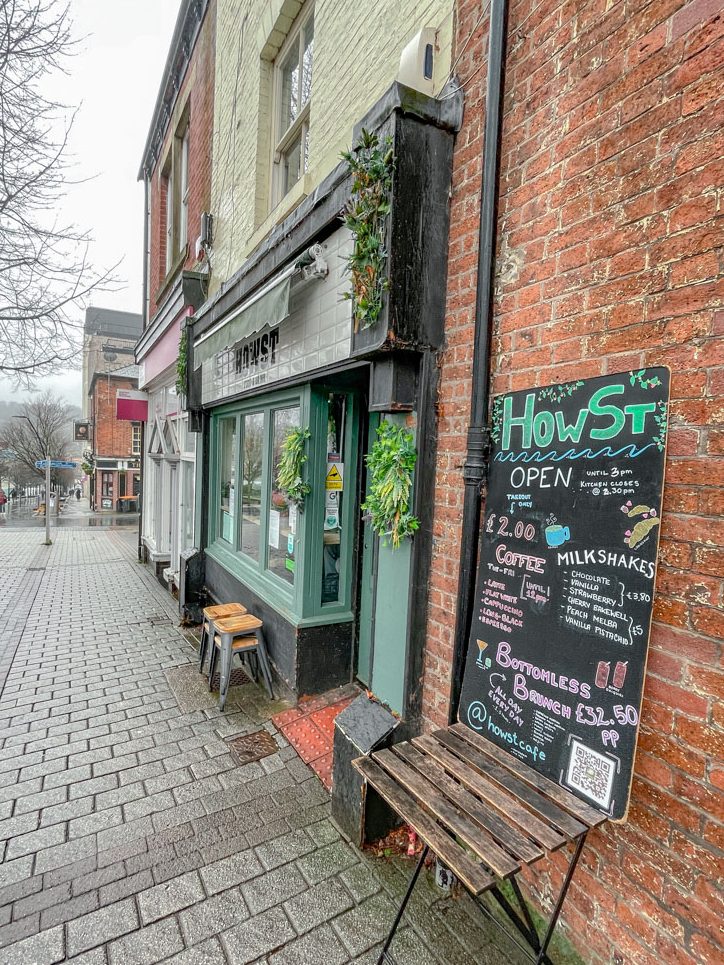 A brick sidewalk with shops in Sheffield, England.
