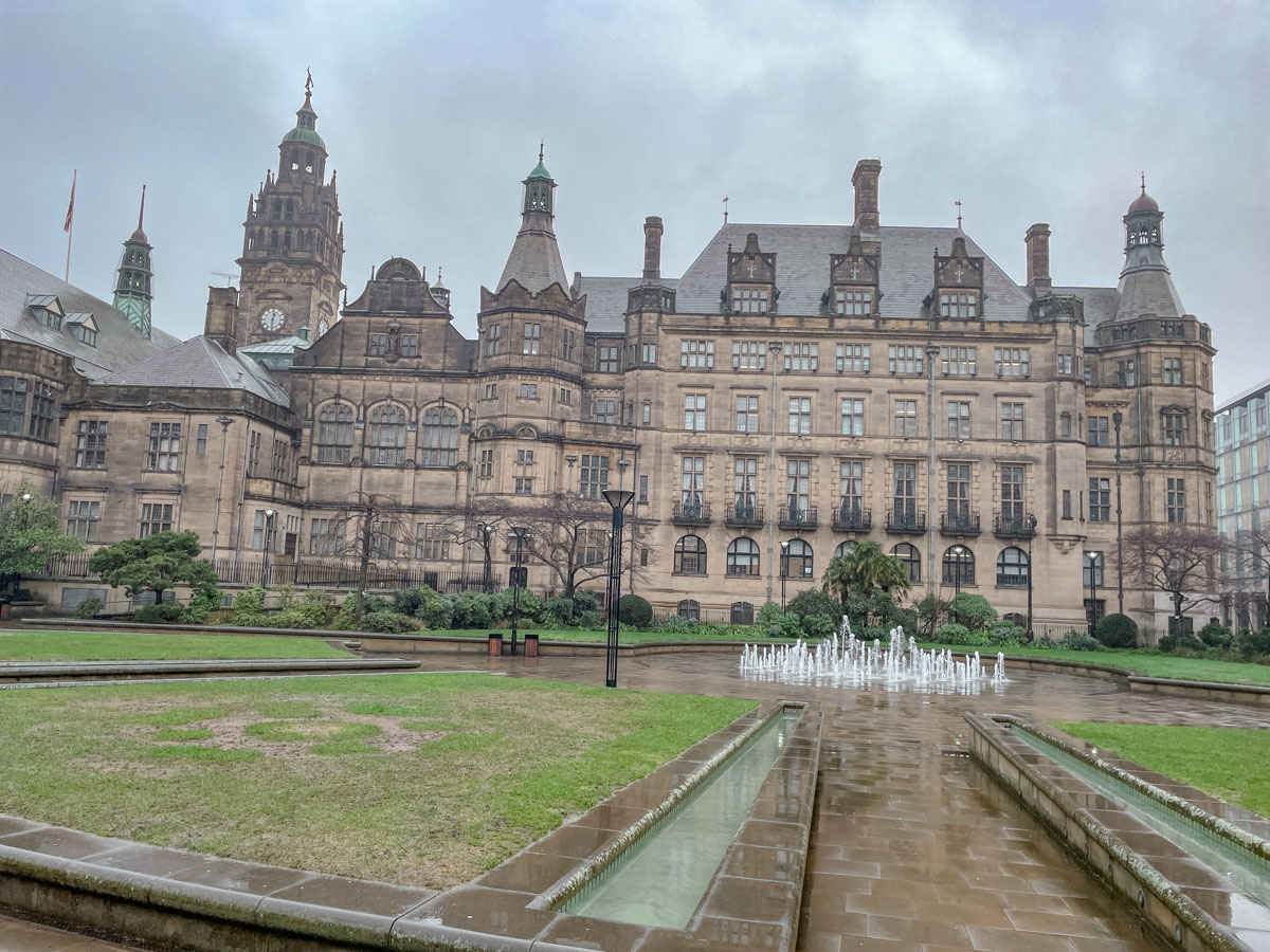 Old building in Sheffield with garden and fountains.