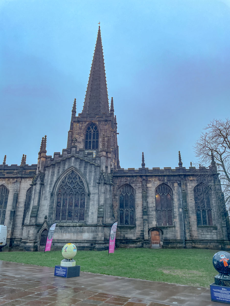 A cathedral building with a long, sharp, triangular roof in Sheffield, UK.