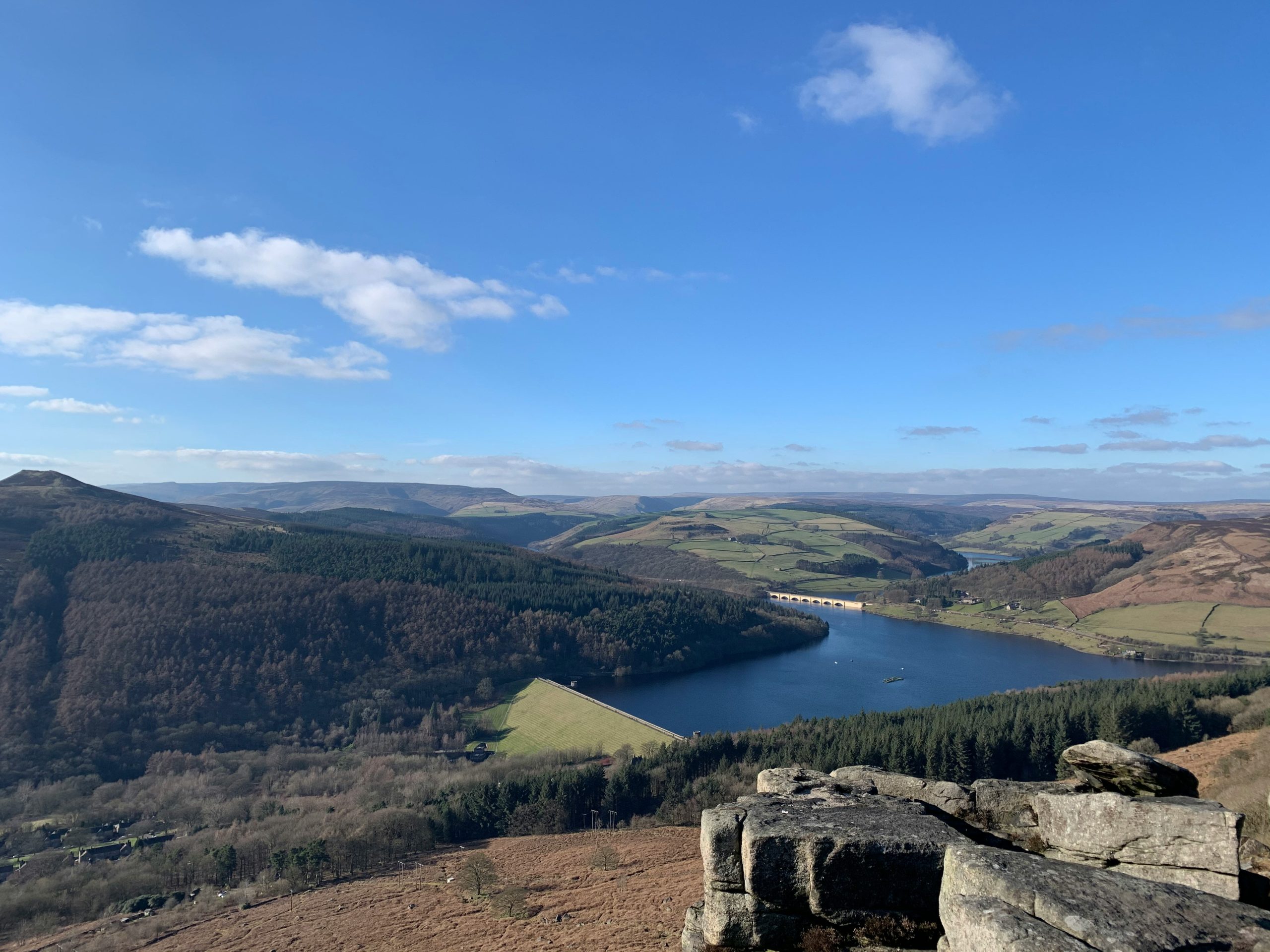 A viewpoint that shows a scenic landscape and a body of water.