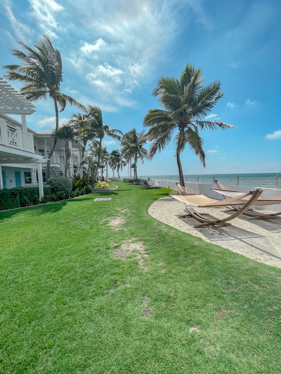 The sea, hammocks, and palm trees at a beach in Key West, Florida.