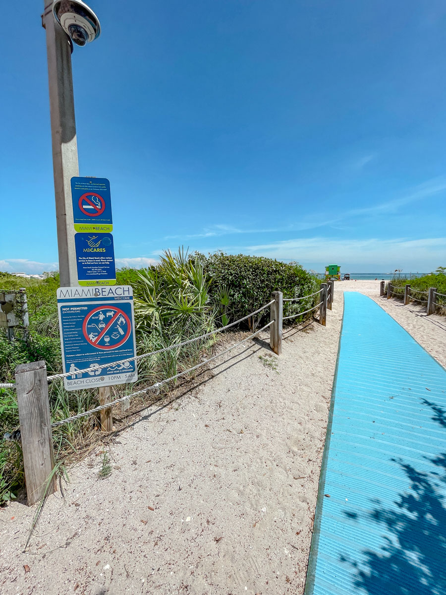 A wooden walkway on a sandy path to Miami Beach.