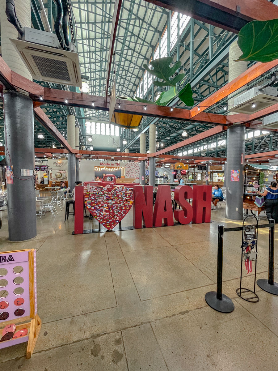 "I [heart] Nashville" lettering figure inside a farmer's market in Nashville.