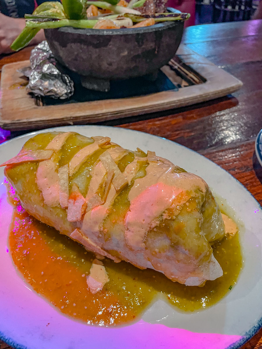 Food on a plate on a wooden table.