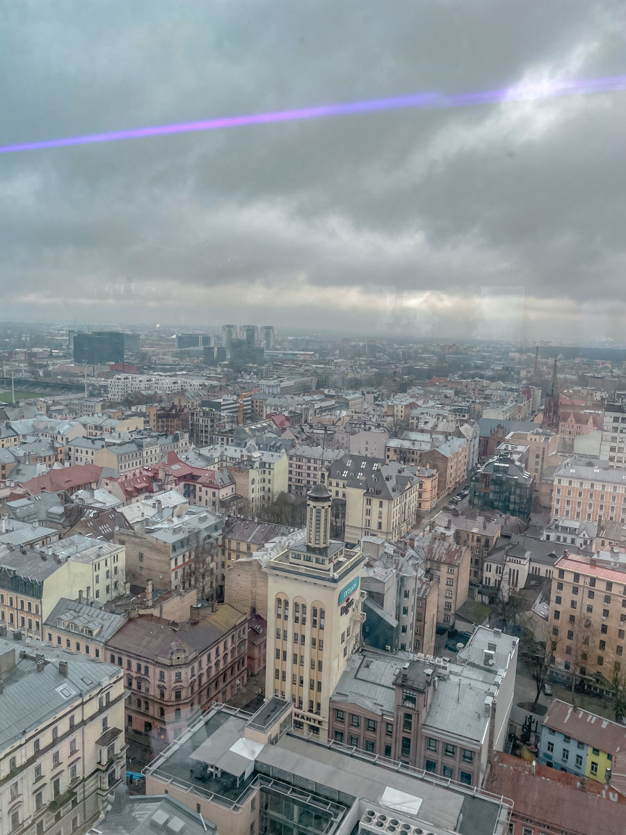 A view of a European city from a high building on a cloudy day.
