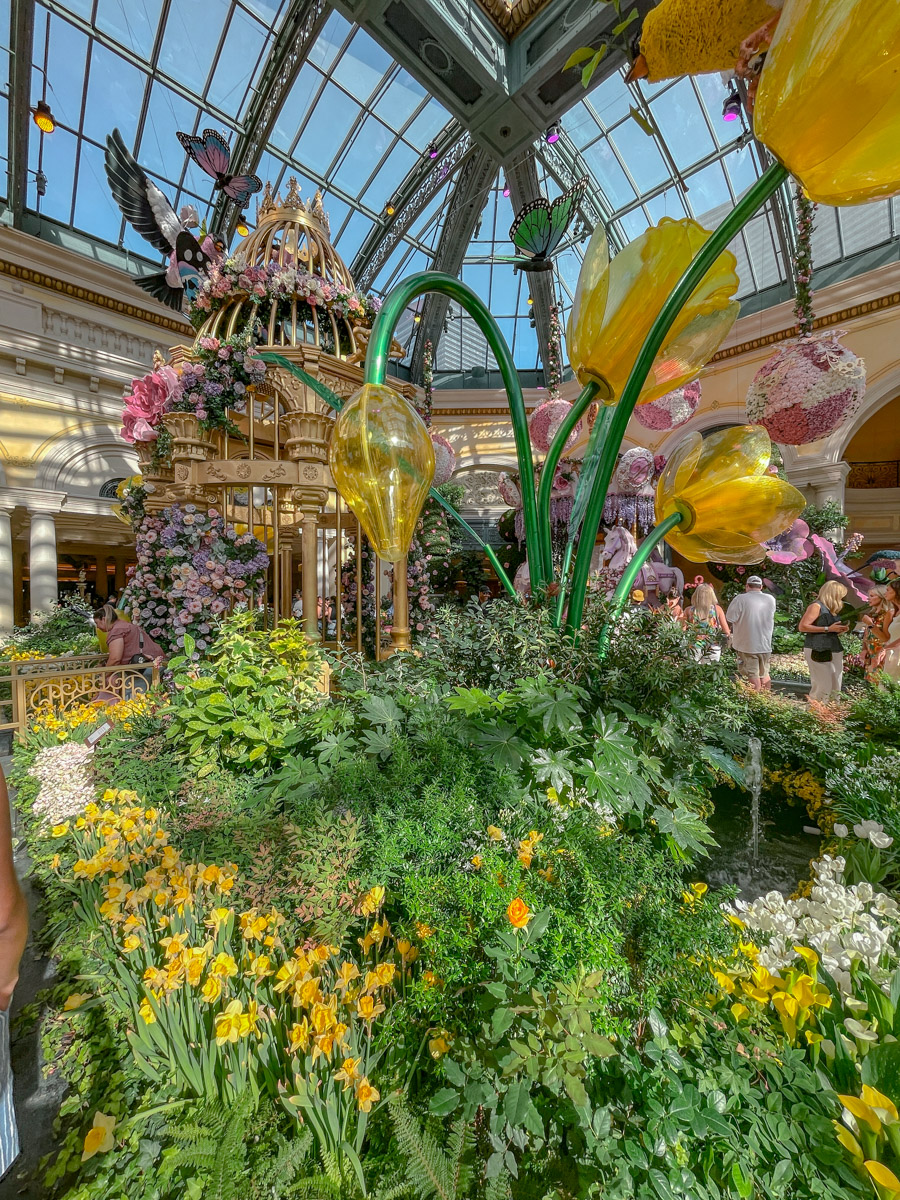 Colorful art and garden exhibit with giant flower displays inside the Bellagio Conservatory & Botanical Gardens in Las Vegas.