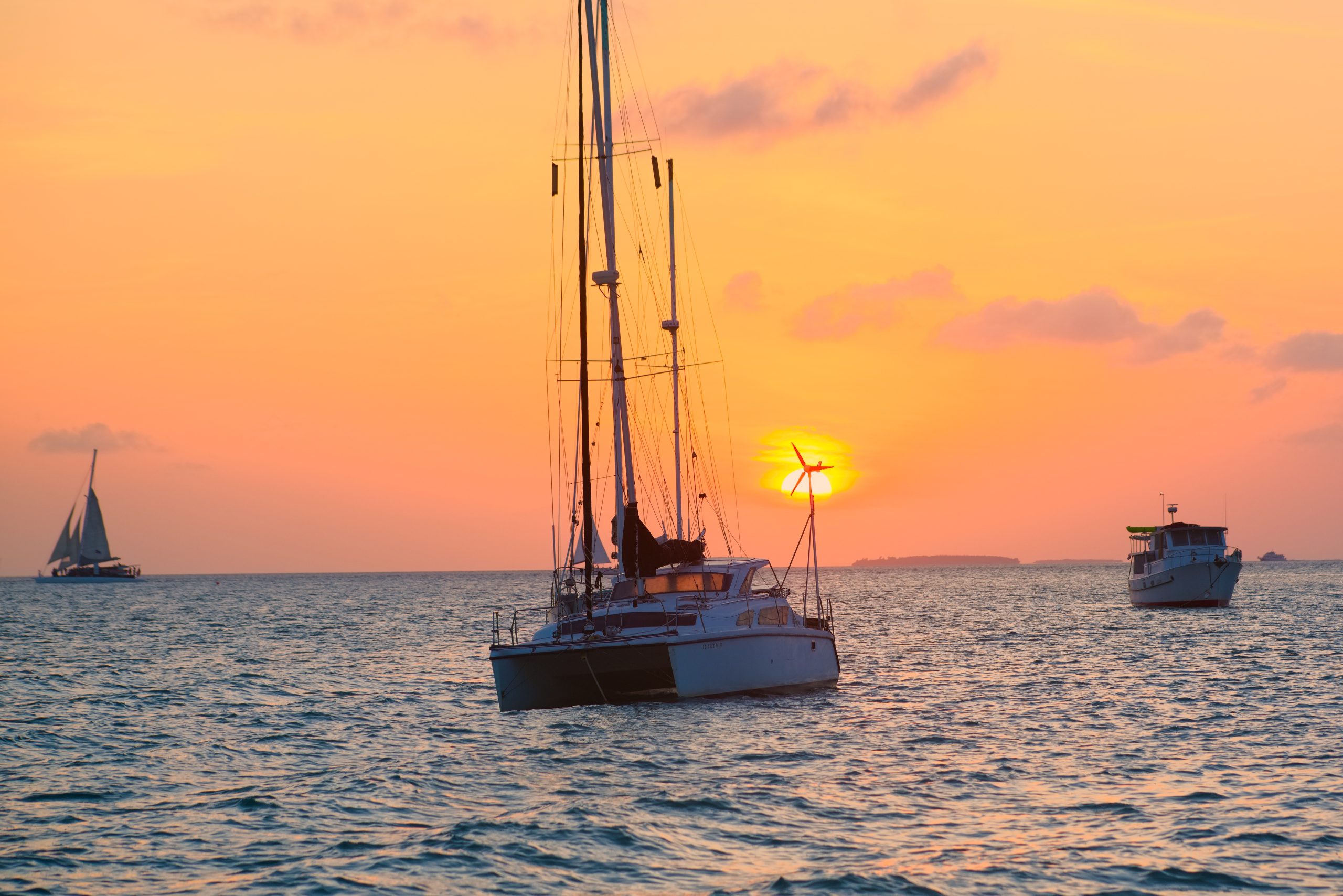 A yacht on water at sunset in Key West, Florida.