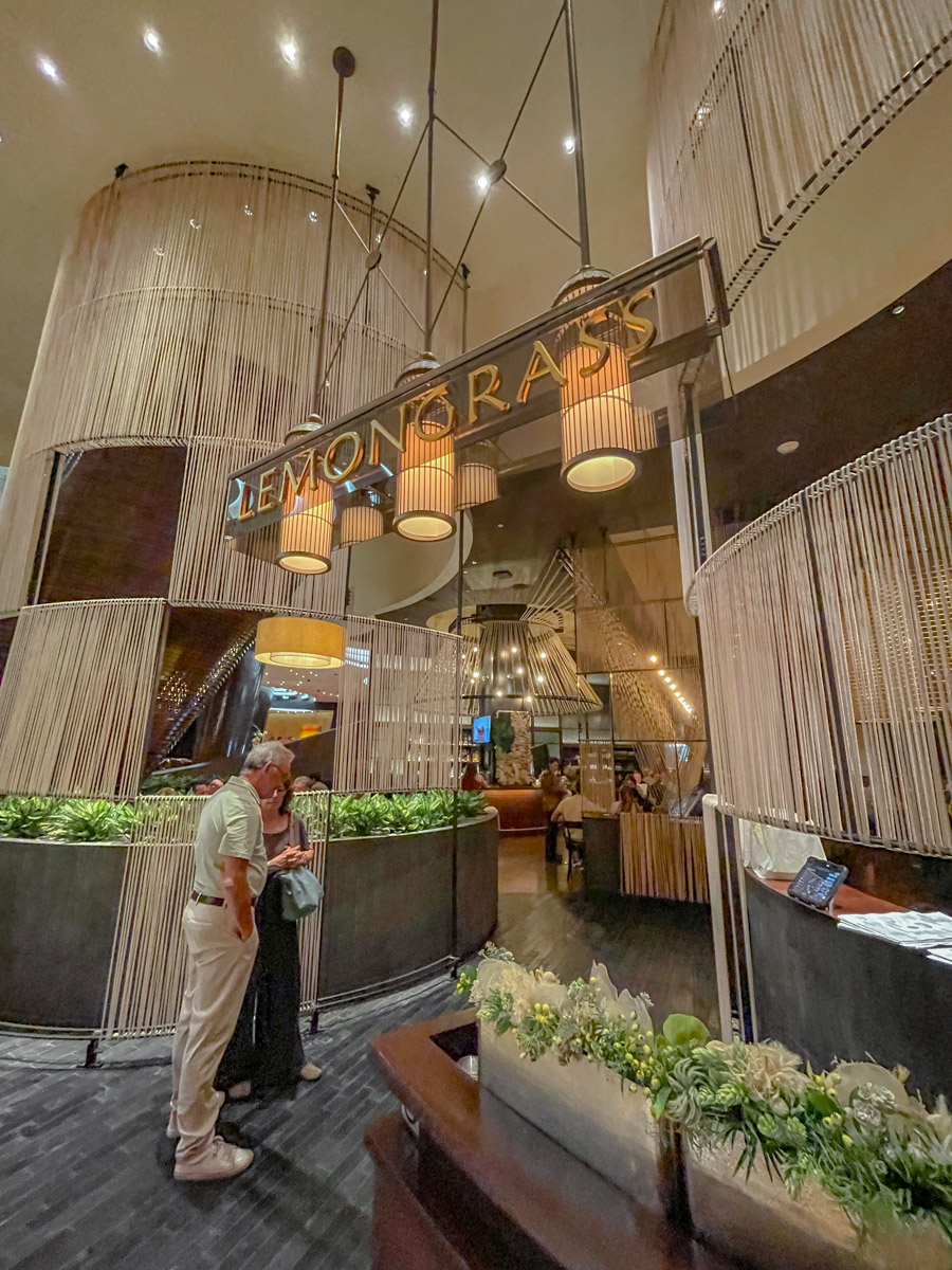 The entrance of a fancy hotel with a sign that says "Lemongrass".