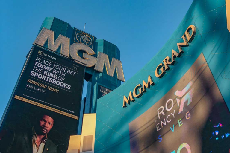 The outside of MGM Grand Las Vegas buildings with signs "MGM" and "MGM Grand".