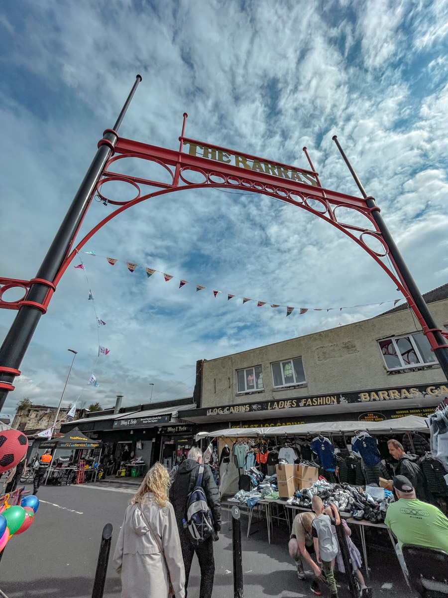 People near the Barras Market arch.